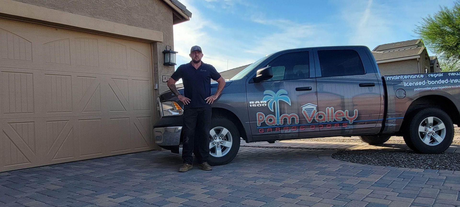 Man standing in front of a truck with a company logo