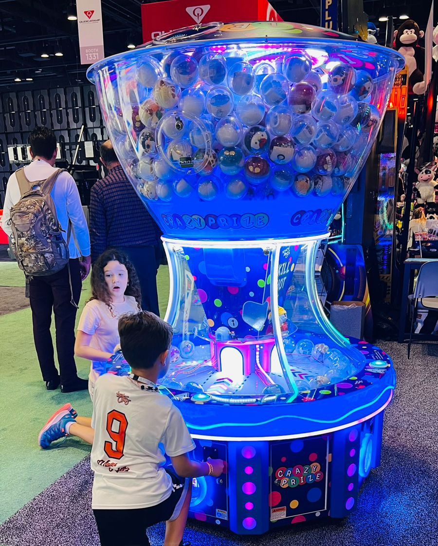 A boy and a girl are playing a game at an amusement park.
