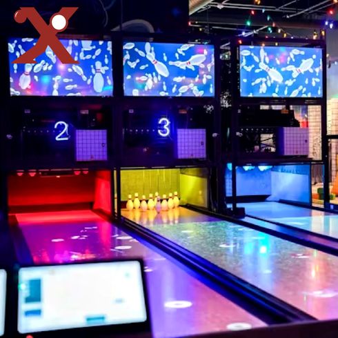 A bowling alley with a sign that says x on it