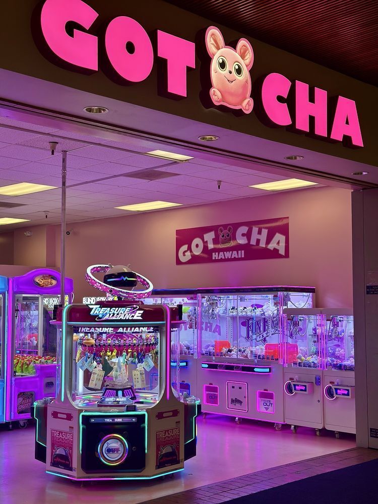 A gotcha arcade with a claw machine in front of it