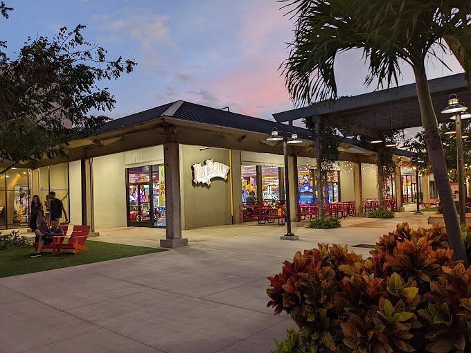 A group of people are standing outside of a building.
