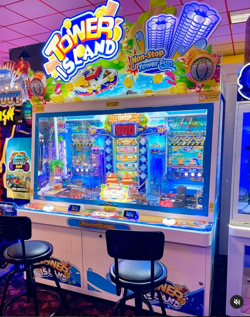 A video game called towers island is sitting in an arcade.