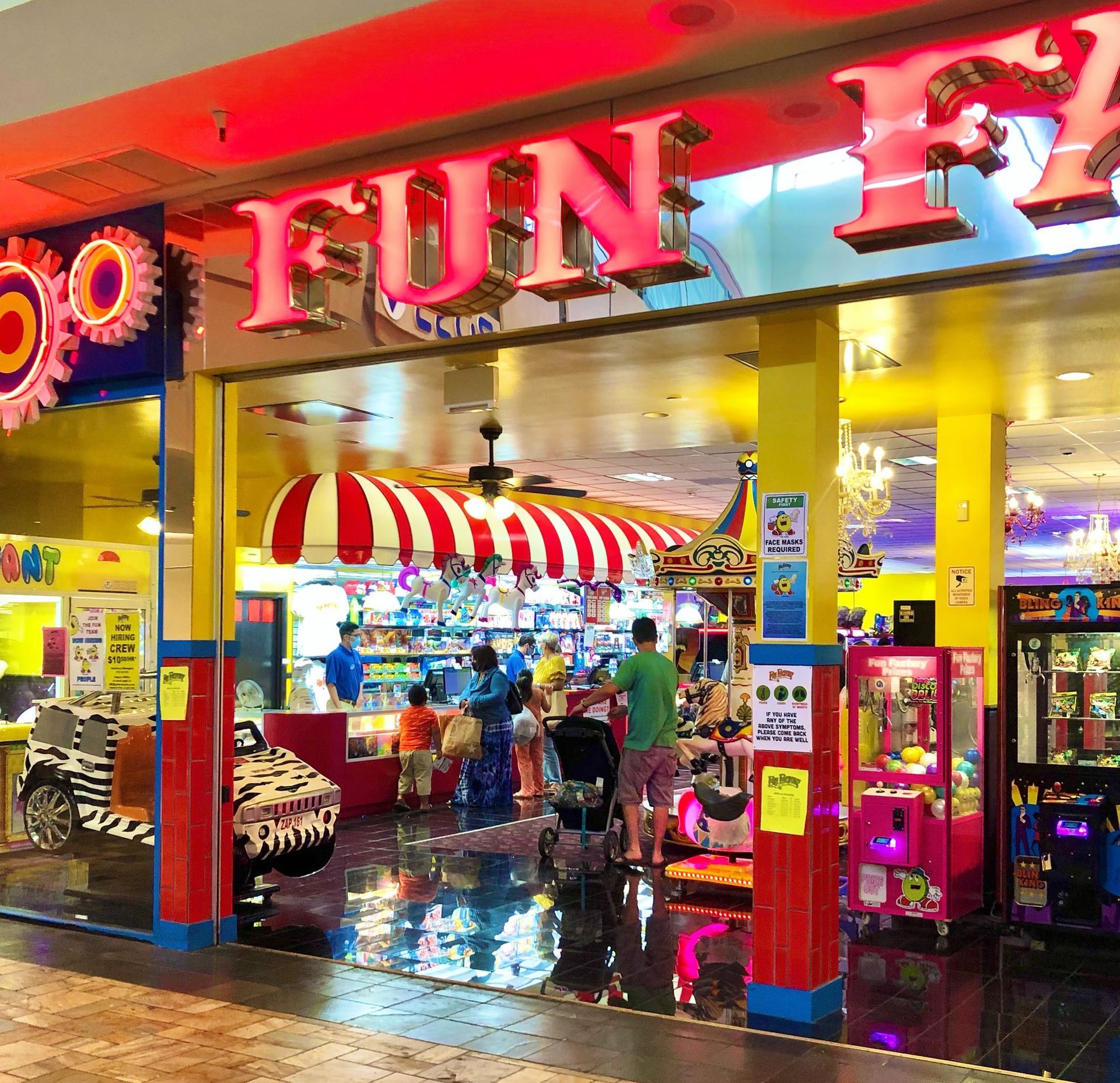 A store with a red sign that says fun on it