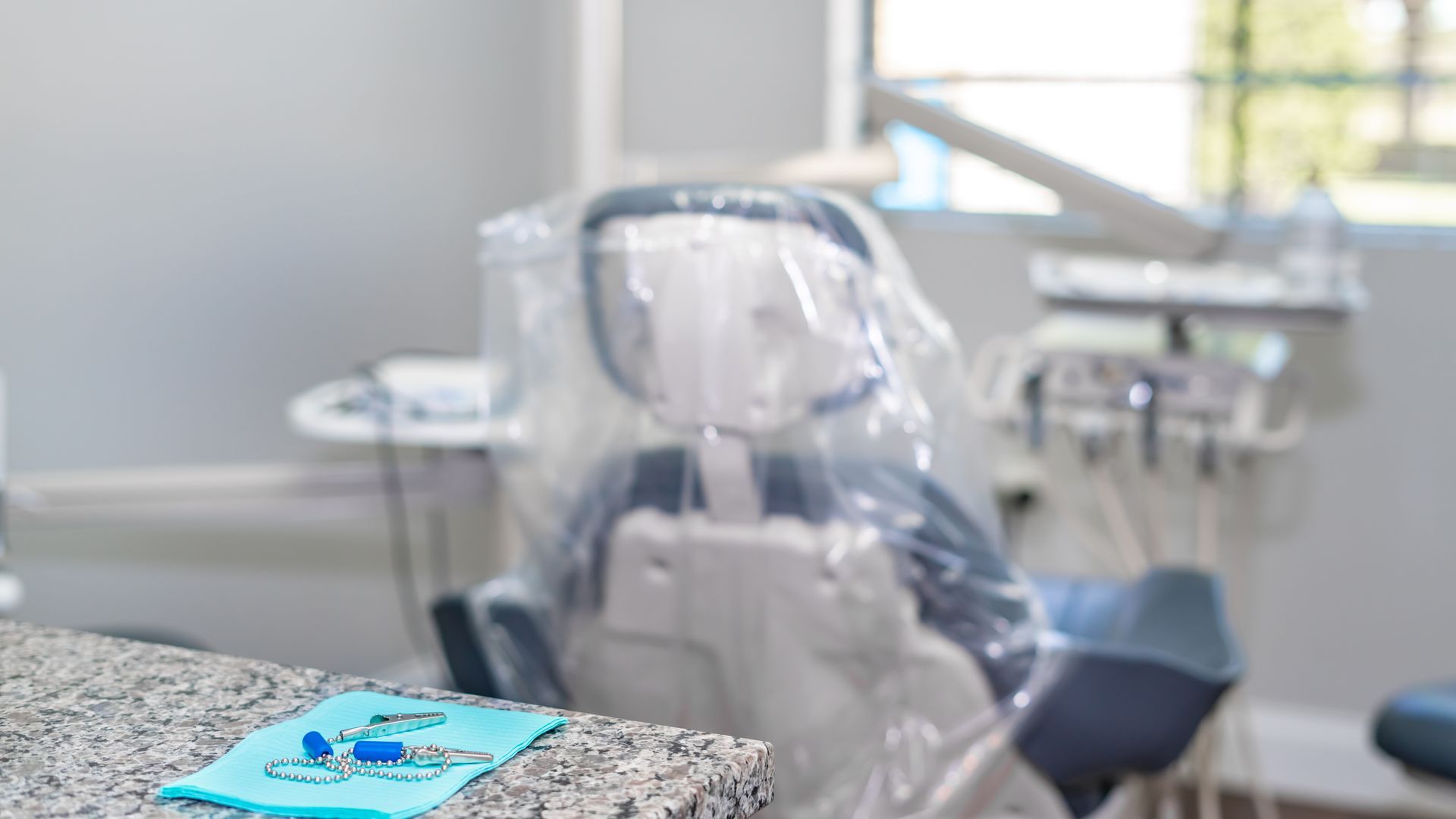 A dental chair is sitting on a counter in a dental office.