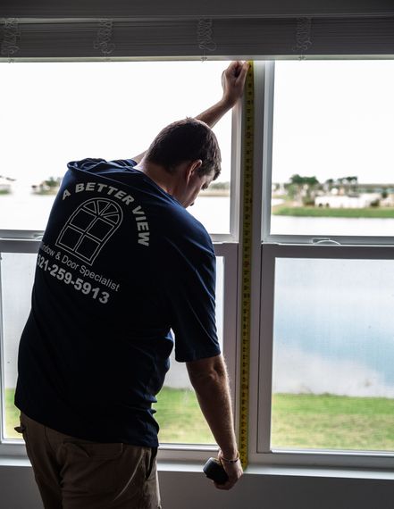 Window Contractors — Two Men Installing New Window in Melbourne, FL
