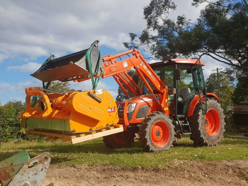 Kioti Tractor Lifting A 900kg Falc Mulcher — North Coast Construction Equipment In Coffs Harbour, NSW