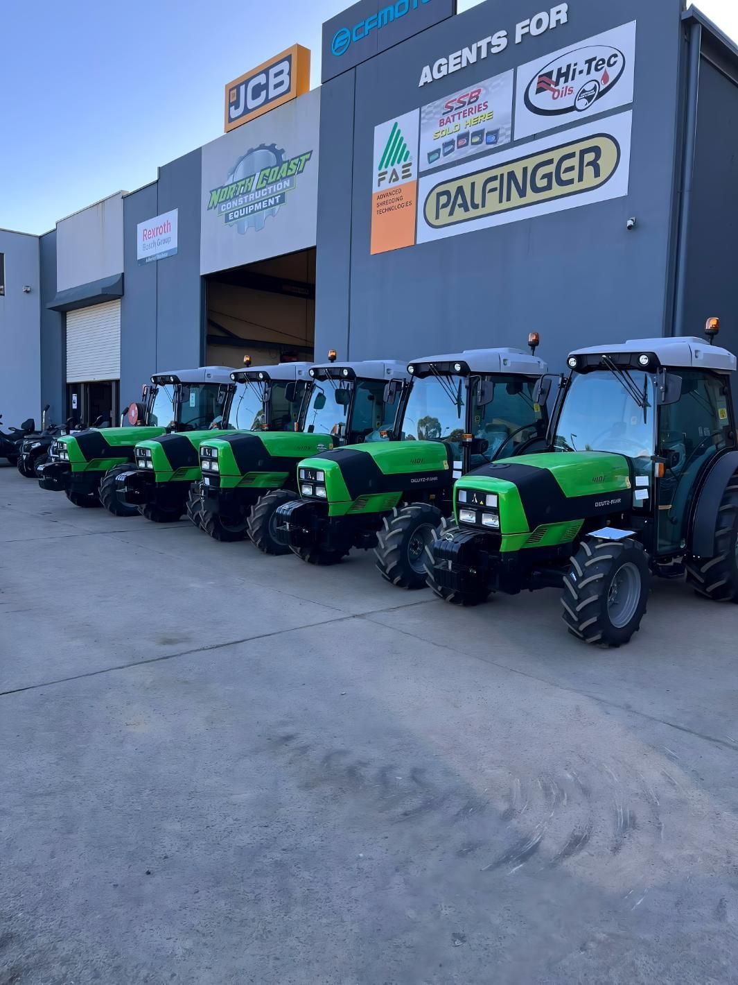 Row of New Green Tractors