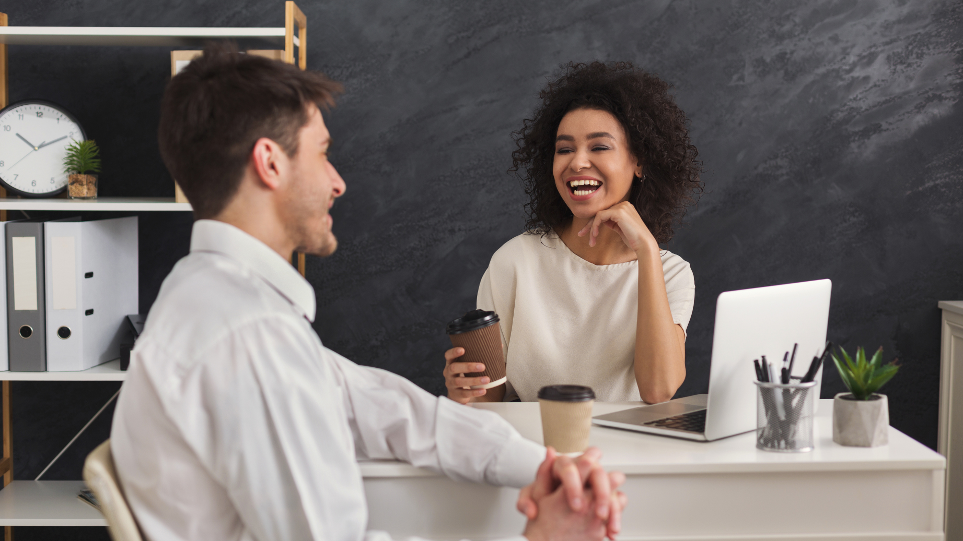 Two people building strong business relationships over a cup of coffee