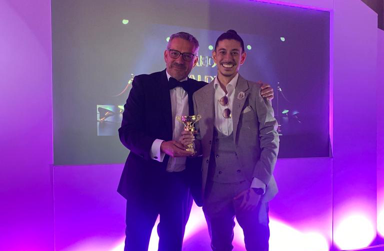 Paul Ross Congratulating someone with an award