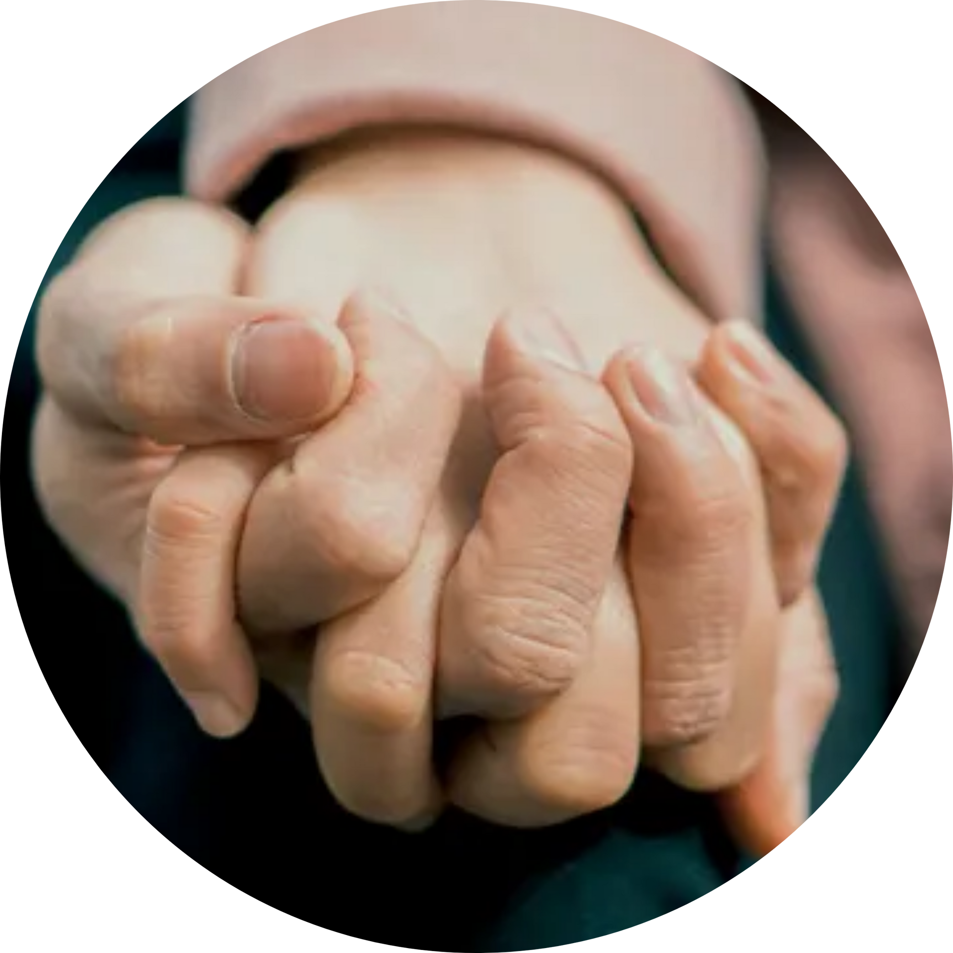 A close up of a person holding another person's hand.