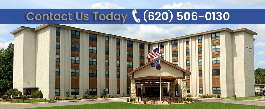 A large building with a flag in front of it that says contact us today