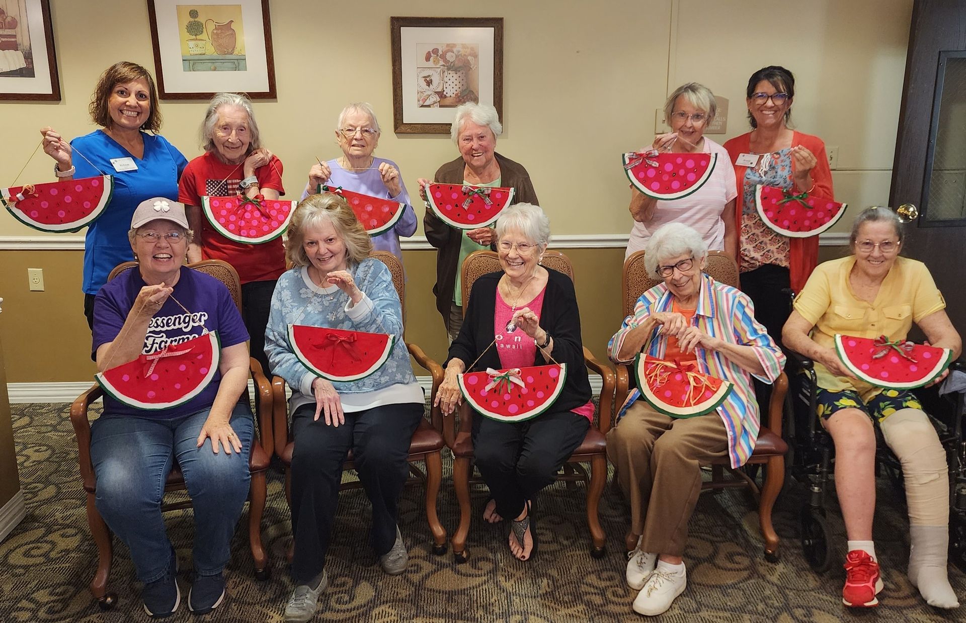 A group of elderly people are holding watermelon slices in their hands.
