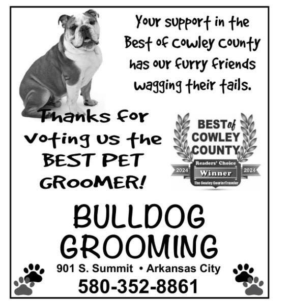 An advertisement for bulldog grooming in arkansas city