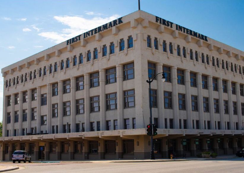 A large building that says first intermark on the side