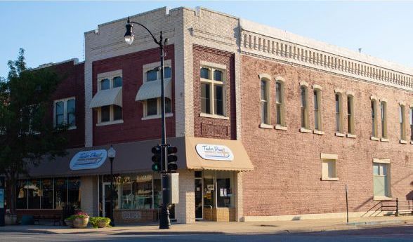 A brick building on the corner of a city street