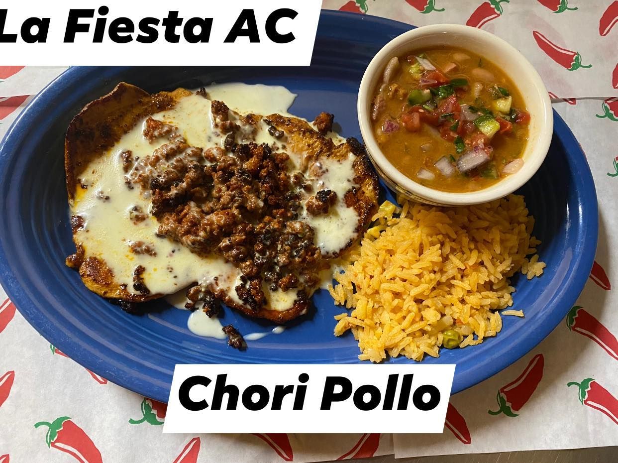 A blue plate topped with chorizo pollo and rice