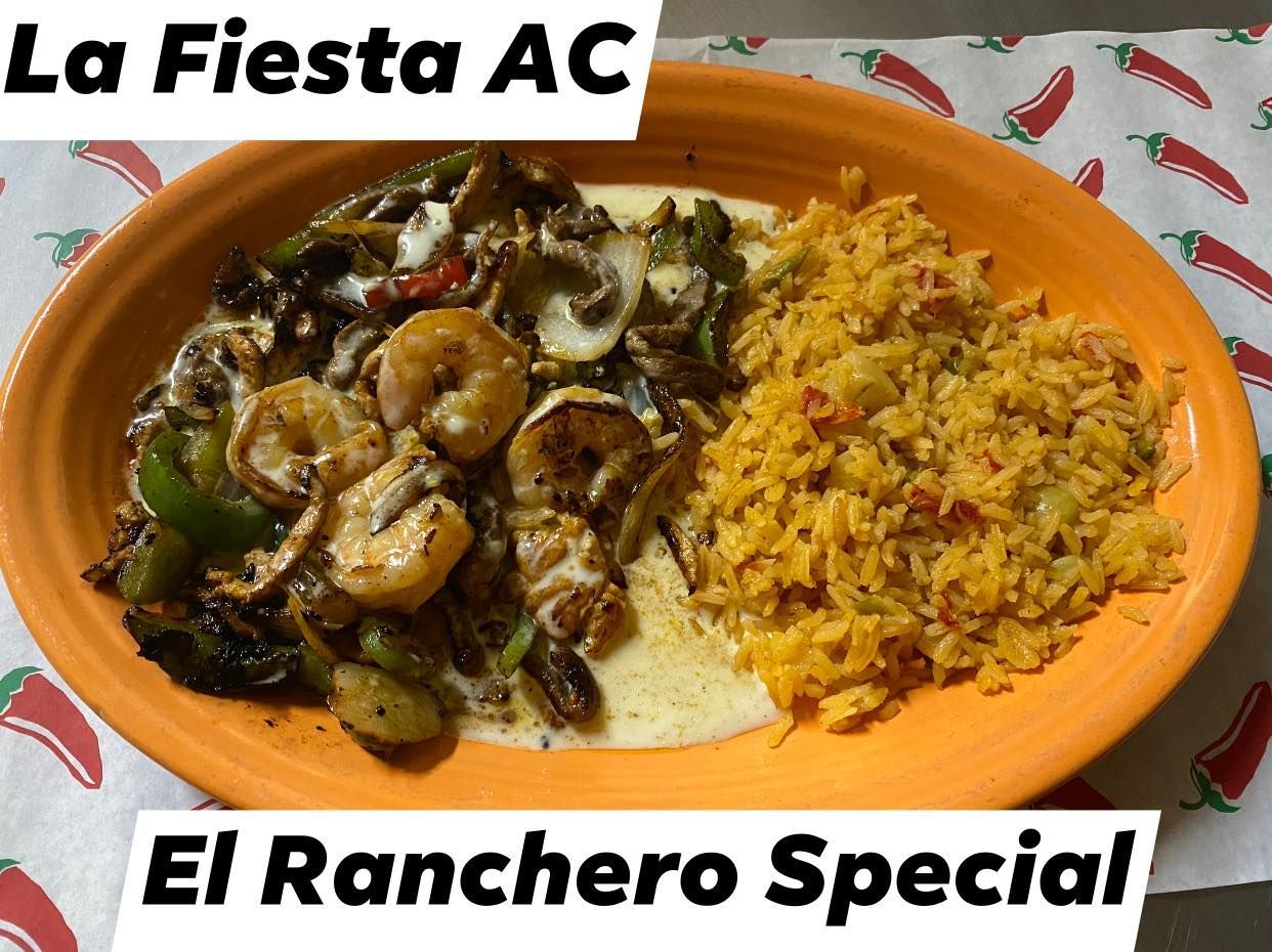 A plate of la fiesta ac el ranchero special shrimp and rice