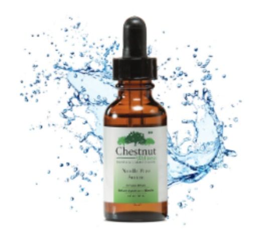 A bottle of chestnut wellness skincare is surrounded by water splashes