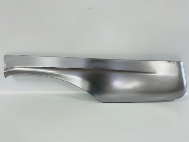 A silver, curved automotive body panel; possibly a fender, on a white background.