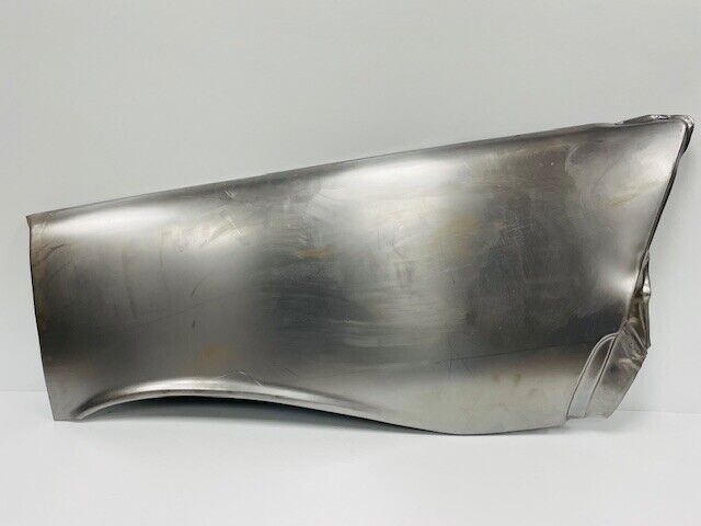 A piece of metal is sitting on a white surface.