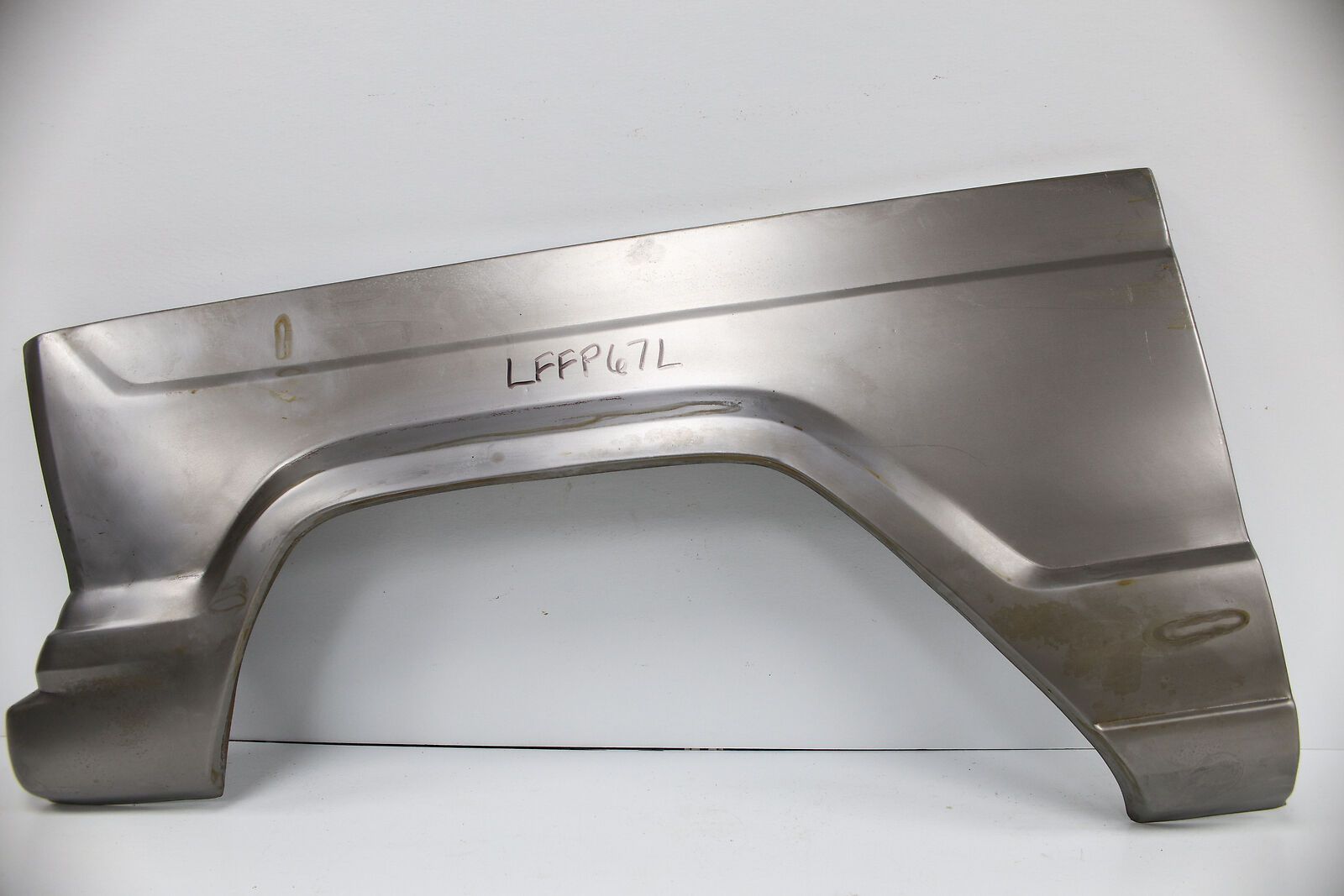 A piece of metal with the word jeep on it