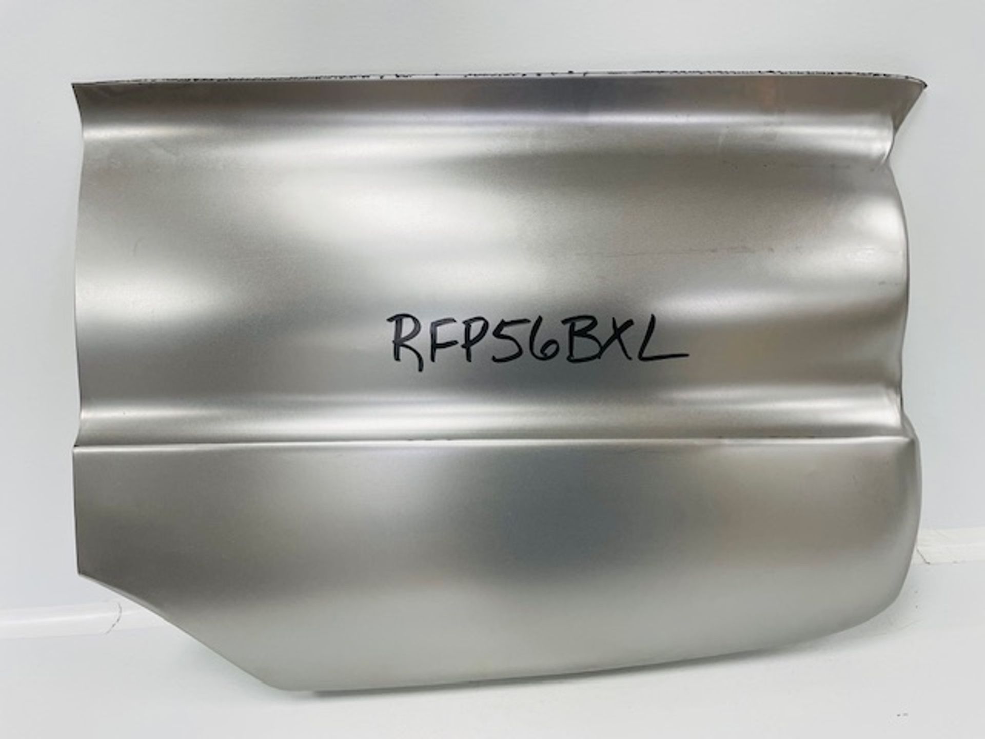 A piece of metal with the word rfp56bxl written on it.