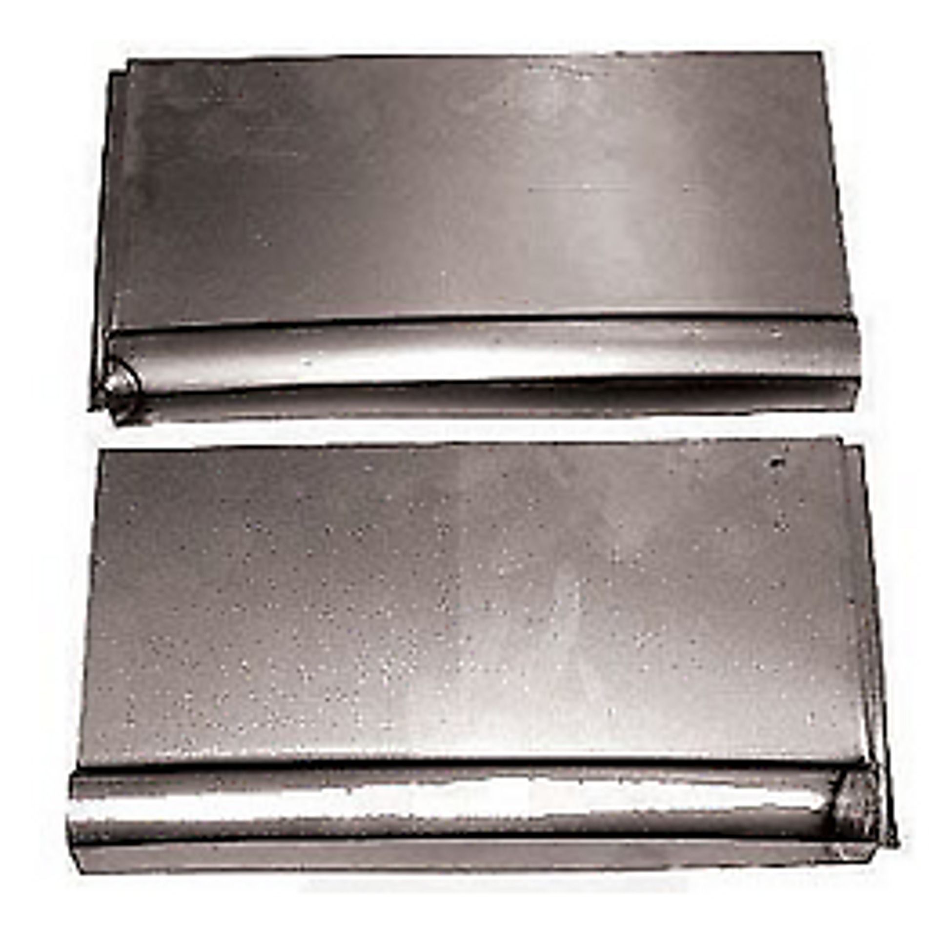 Two pieces of metal are sitting next to each other on a white surface.