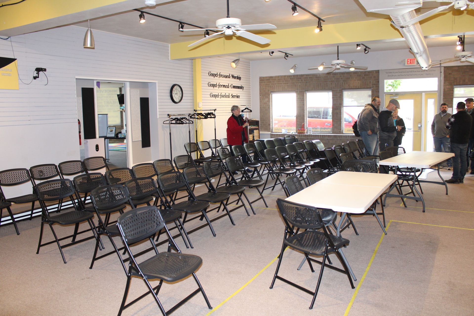 A large room with tables and chairs in it