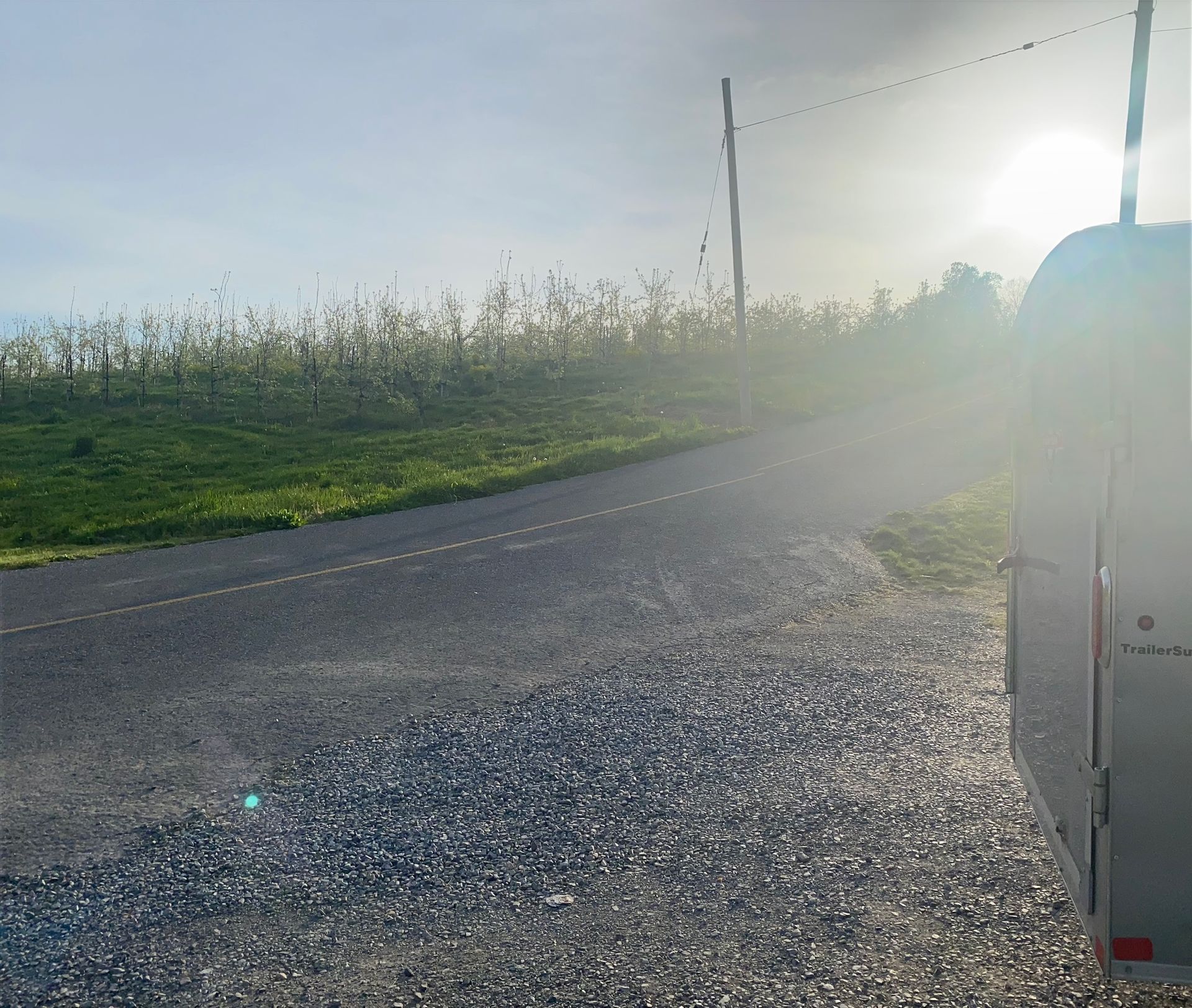 A white van is parked on the side of a road