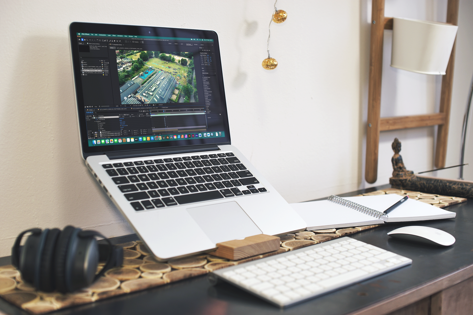 A laptop computer is sitting on top of a desk next to a keyboard and mouse.