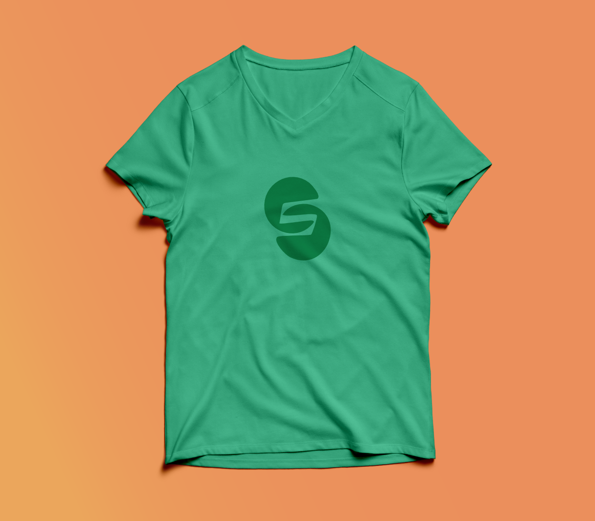 A green t-shirt with the letter s for Sneak logo on it