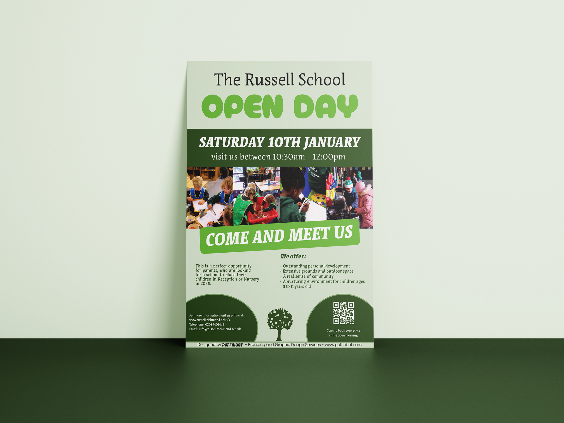 A person is holding a piece of paper with a picture of a group of people on it.