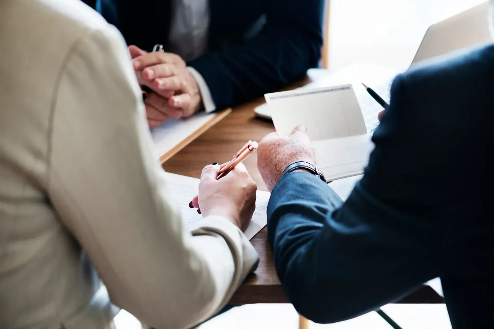 Business clients reviewing funding documents during a finance meeting