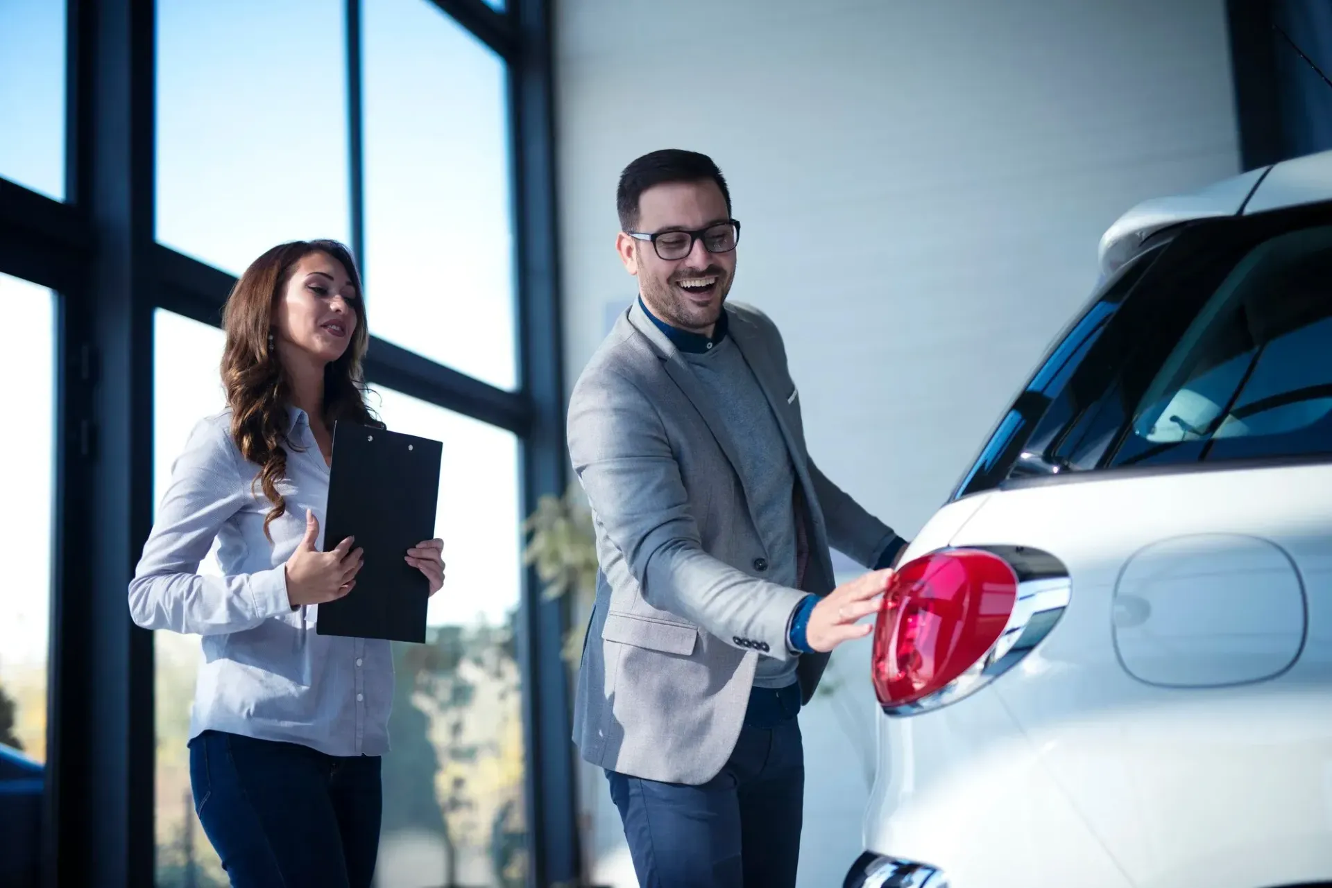 Customer inspecting a vehicle during a finance consultation