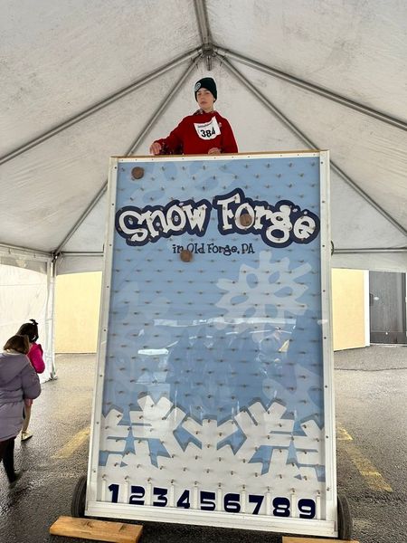 Boy standing behind a 