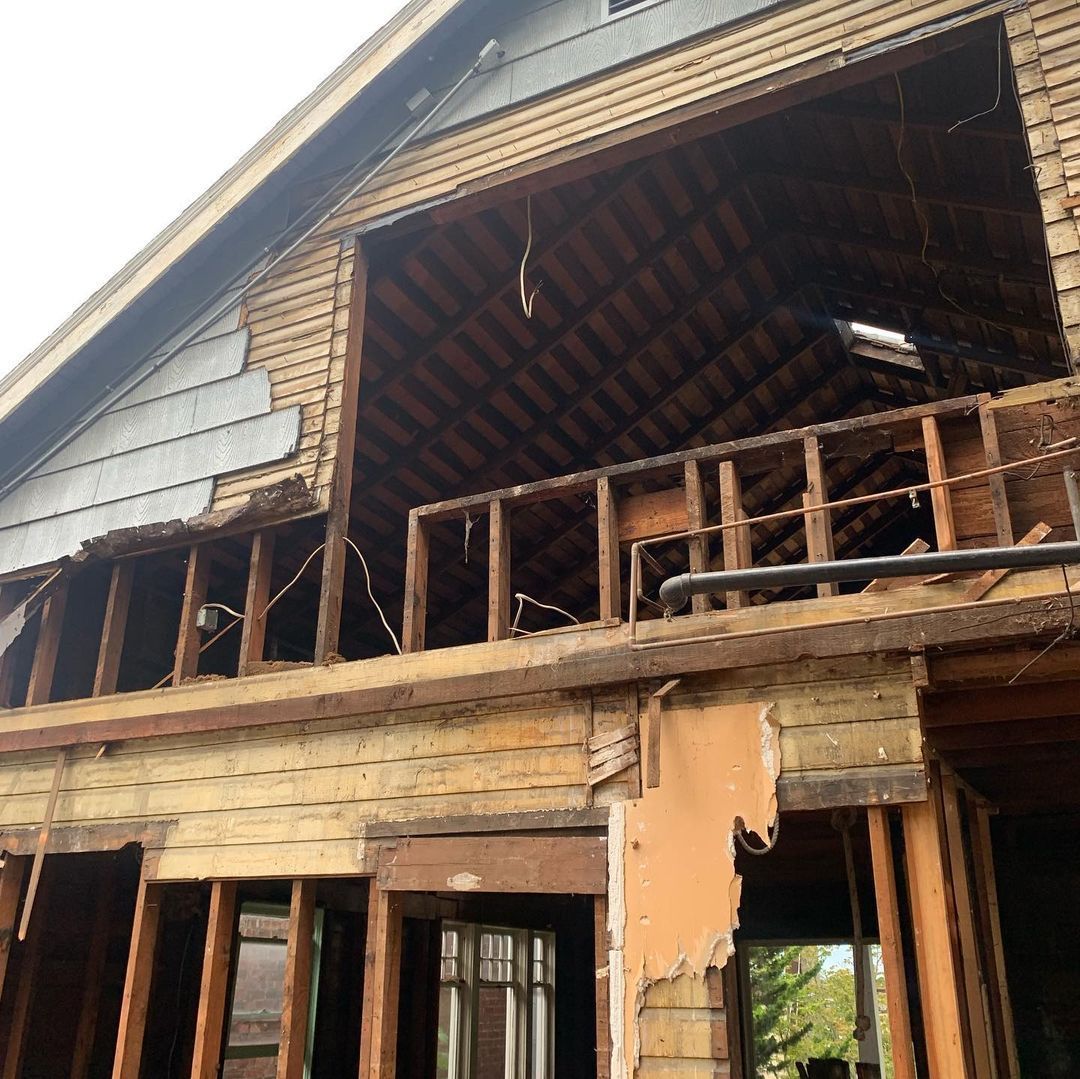 A house is being demolished and the roof is missing
