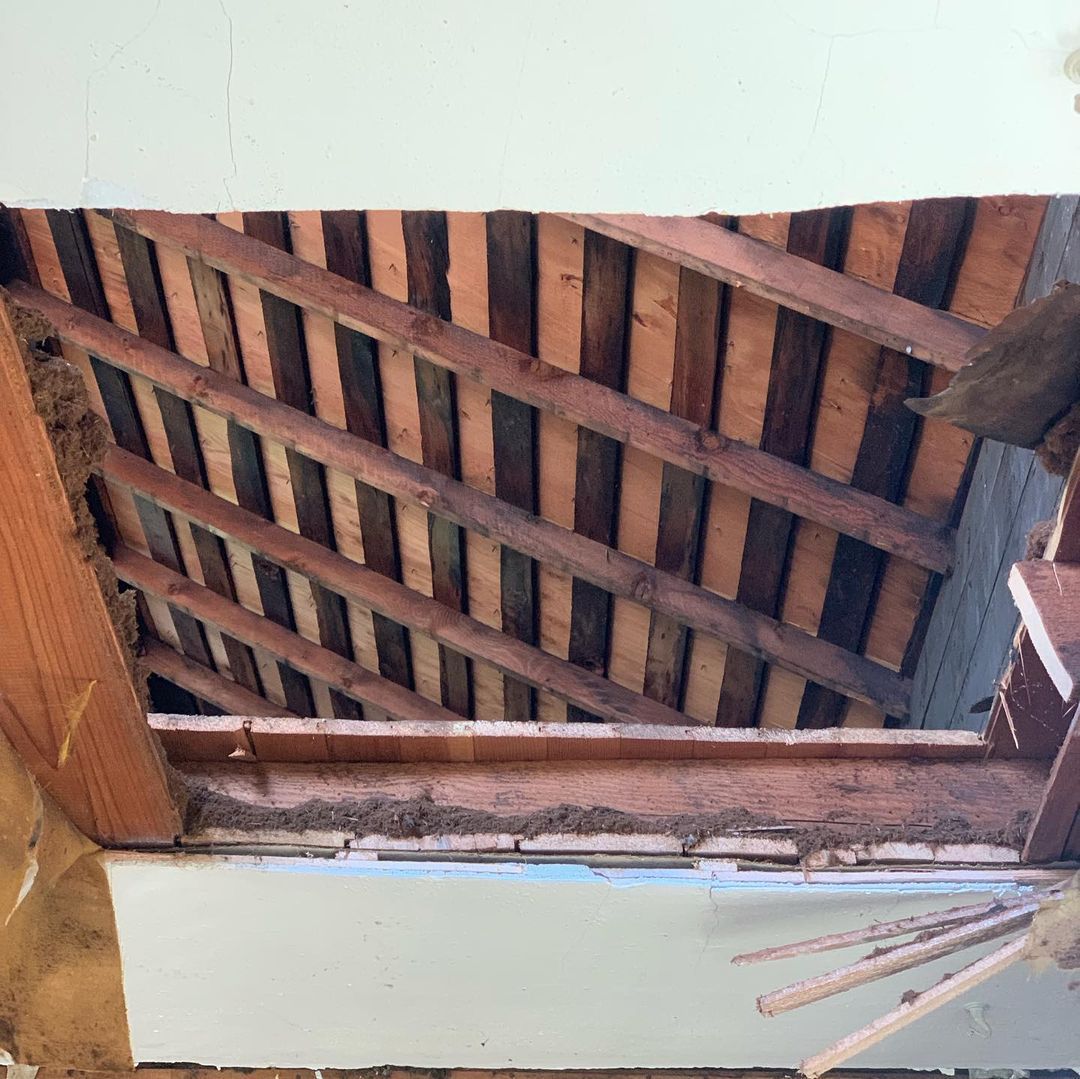 Looking through a hole in the ceiling of a building.