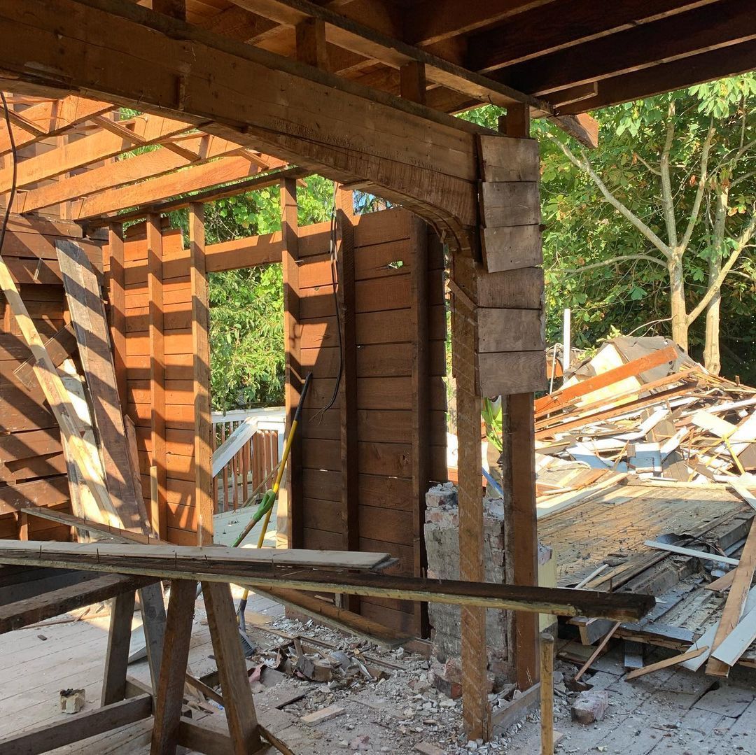 A wooden structure is being built with a lot of wood