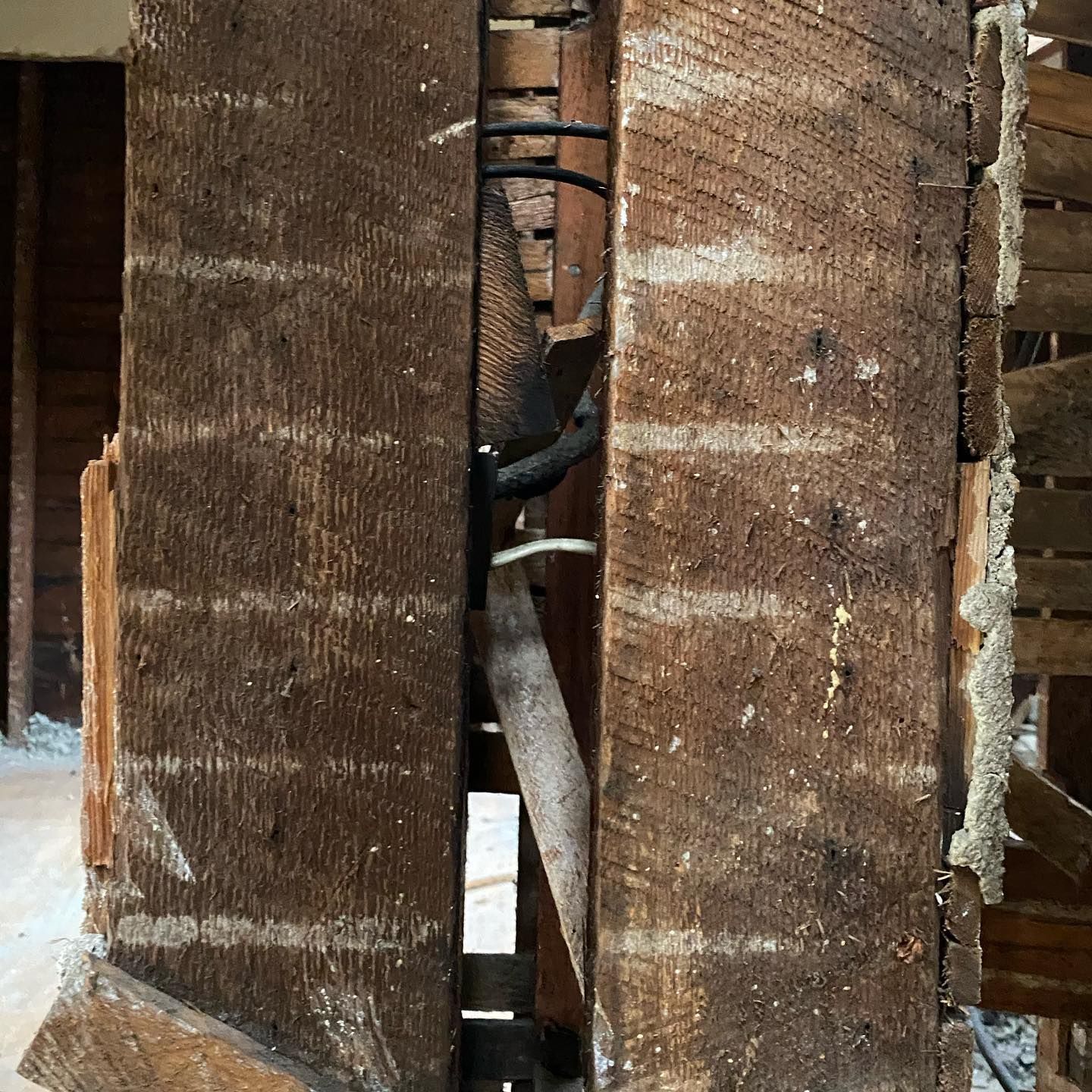 A large piece of wood with a hole in it