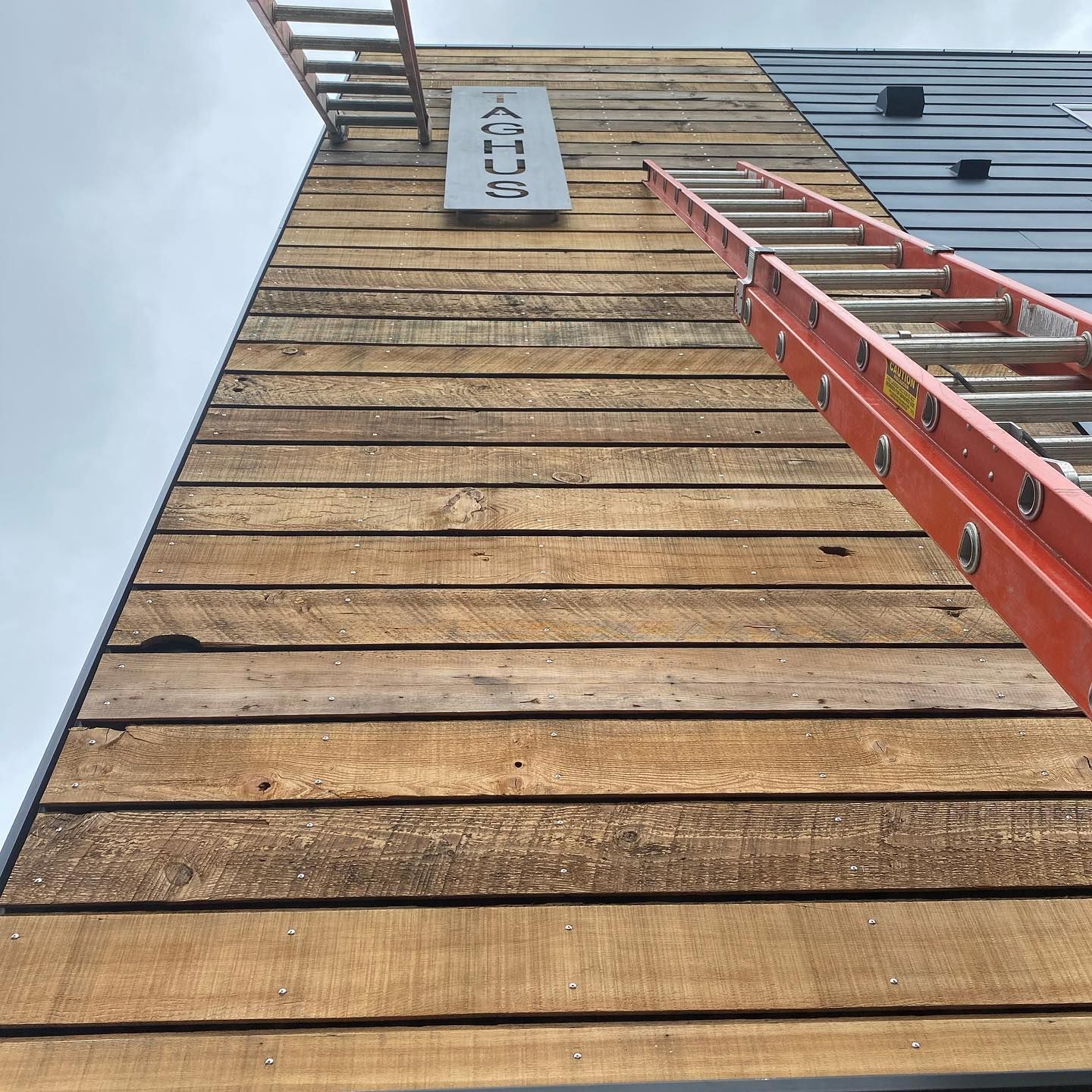 A ladder is attached to the side of a building