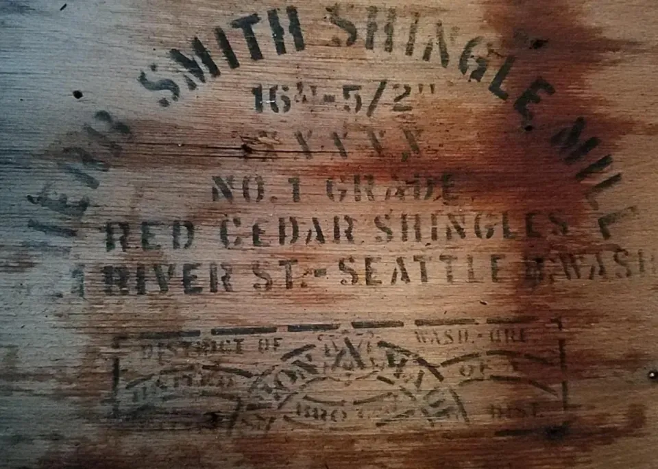 A close up of a wooden box that says smith shingle mill