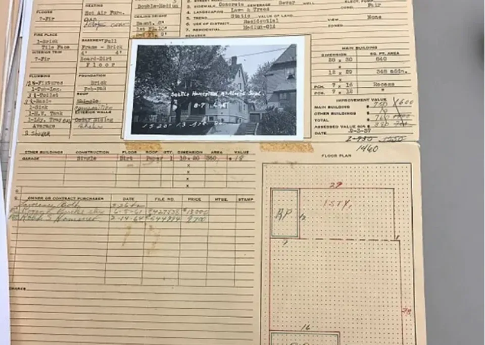 A sheet of paper with a picture of a house on it