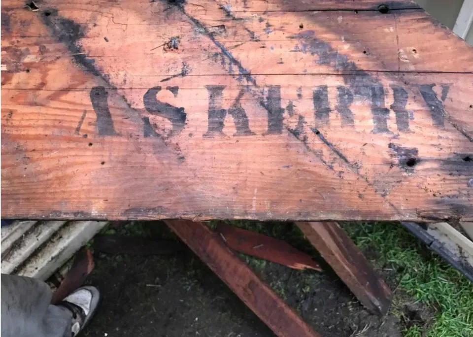A piece of wood with the word army painted on it