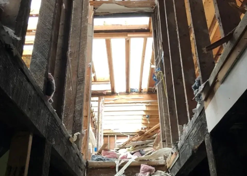 Looking up at the ceiling of a building that is being demolished