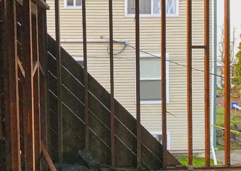 A staircase is being built in front of a house.