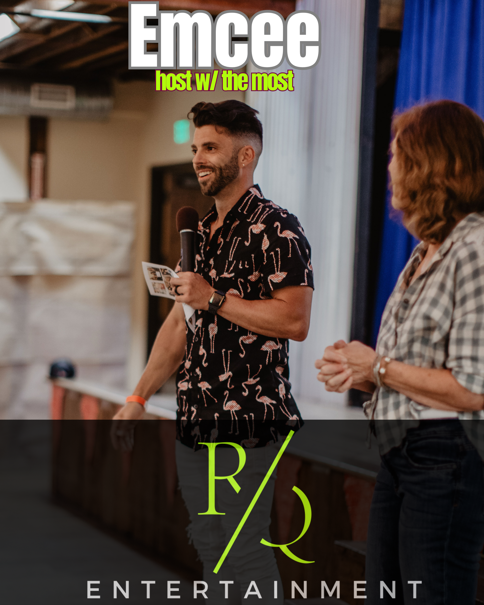 A man in a flamingo shirt is speaking into a microphone