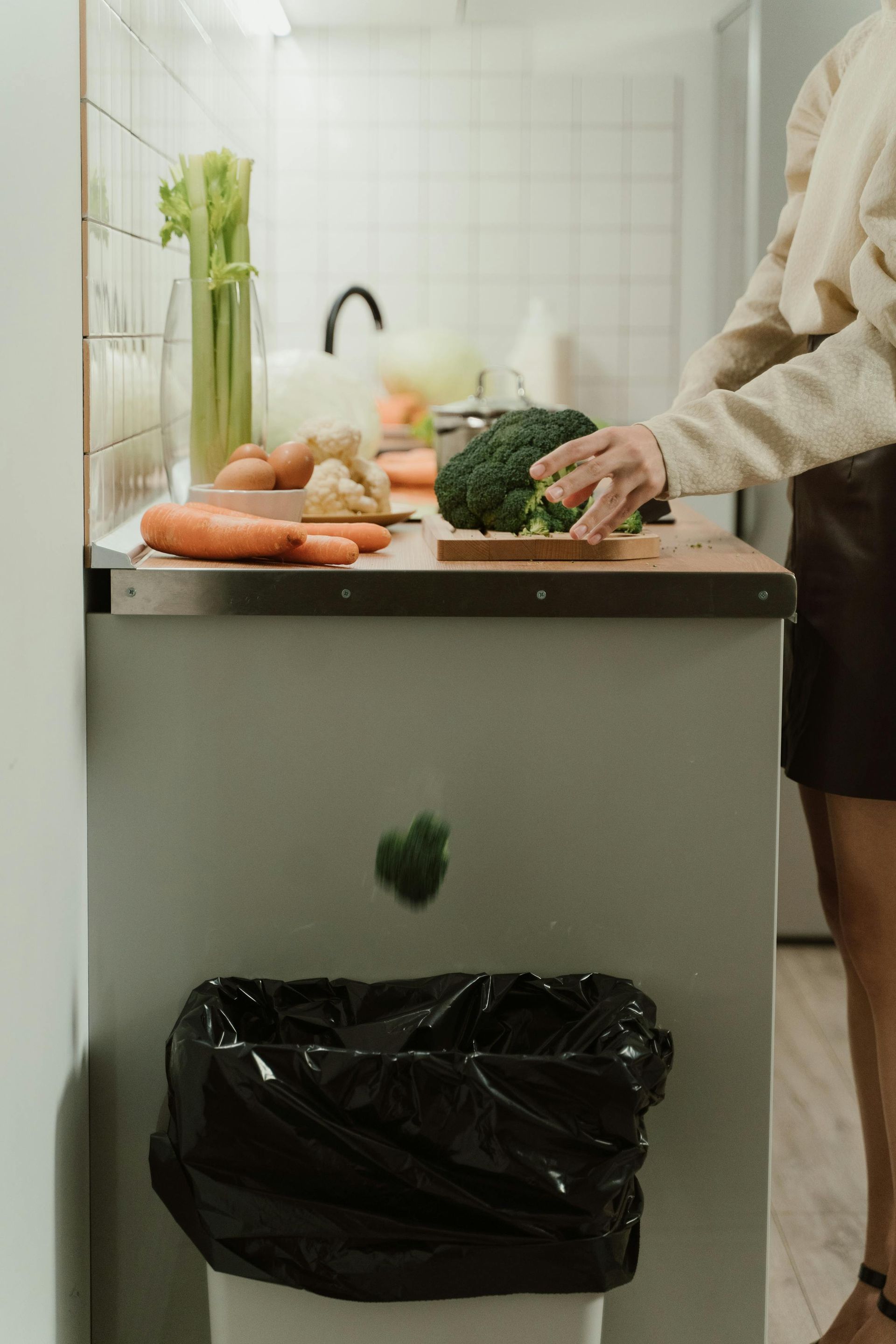 Kitchen food prep scene highlighting garbage disposal benefits for Chicago homes