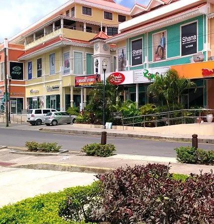 A street with a lot of buildings and a sign that says ' shanti ' on it
