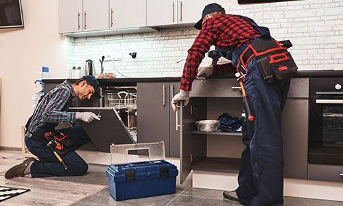 Two Plumber Fixing the Kitchen — Baldwinsville, NY — Fritcher’s Heating, Air Conditioning & Plumbing