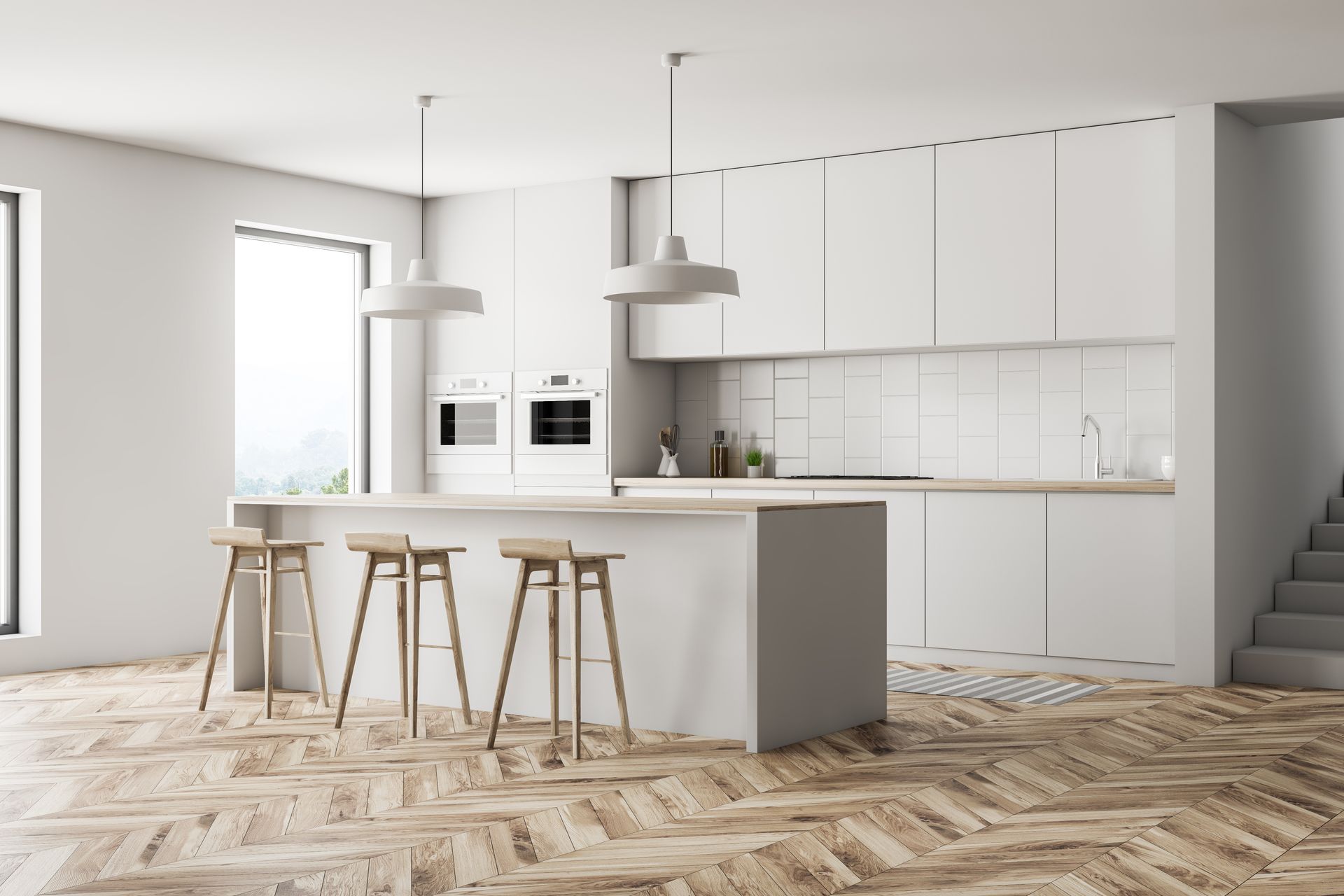 Modern, minimalist kitchen with white cabinets, wood island, stools, and herringbone floor.